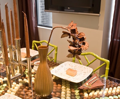 Details like long-stemmed chocolate roses and chocolate candles add whimsical touches to the suite.