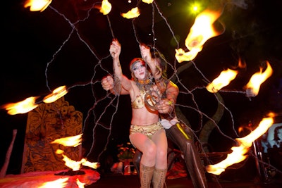 Performers played with fire on platforms throughout the party space.