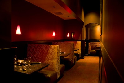 The Melting Pot restaurant features enclosed booths with a semiprivate feel.