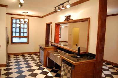 The mansion features two bars (one with a beer tap) and a full kitchen.