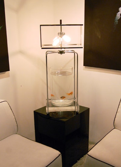 Live fish floated in a lamp in a seating area reserved for the photographer Rankin.