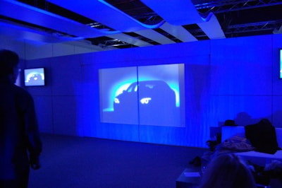 Event organizers projected an image of a BMW onto a set of doors in the lounge that opened to reveal the new vehicle.