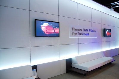Four screens located in the viewing area broadcast images of the new model.