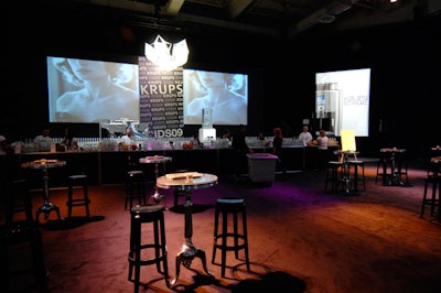 Contemporary Furniture Rentals used silver, black, and grey furnishings to dress the lounge area beside the Krups stage.