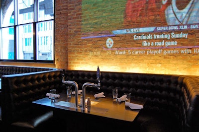 Presentations can be broadcast on 10-foot HD projection screen on an exposed brick wall in the back of the venue.