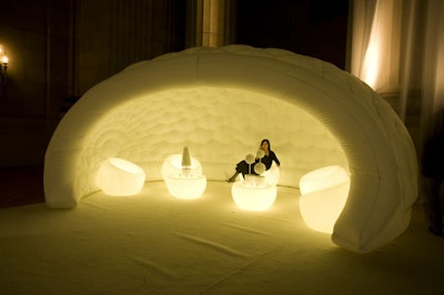 Giant plastic igloos purchased from Inflate sheltered unconventional seating areas.