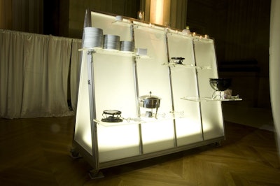 Occasions Caterers set up glowing mobile hors d'oeuvres stations for guests to nibble on french fries, pigs in a blanket, risotto cakes, and mini sandwiches.