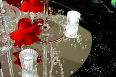 At each dinner table, centerpieces featured mirrored bases strewn with diamond crystals.