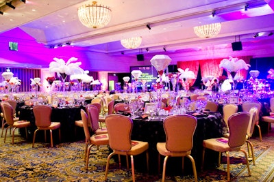 Centerpieces featured white feathers and oversize diamonds.