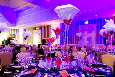 Crystal garlands hung between tall martini glasses on each tabletop.
