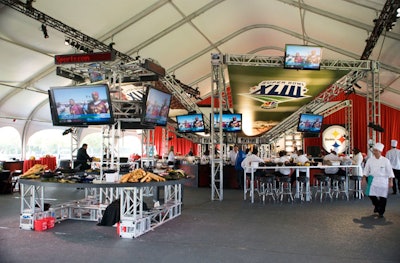 NBC's Sunday Tailgate party took place under a 13,000-square-foot tent at Steinbrenner Stadium—the Yankee's spring training home—which is across the street from Raymond James Stadium. Football-themed graphics and more than 40 plasma TVs accented the tent, along with pool tables, shuffleboards, and football centerpieces that were repurposed for tossing in the outfield.