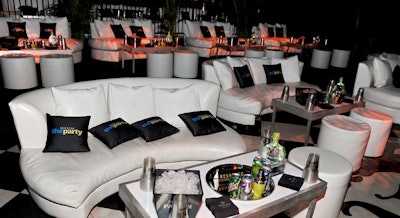 Room Service provided sleek white leather couches and ottomans as well as branded pillows for the V.I.P. lounge.