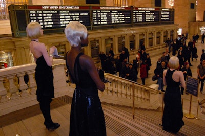 The models proved to be such a distraction to passersby at their first appearance, staff at Grand Central had to ask that they move to one side of the terminal.