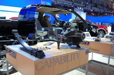 Ford shows a cross-section of a full-scale F-150 truck with a hands-on parts display.