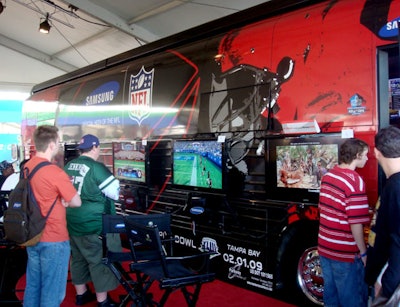 As one of the more than eight sponsor tents at the Experience, Samsung brought in its two traveling busses outfitted with LCD TVs and X-Box stations.