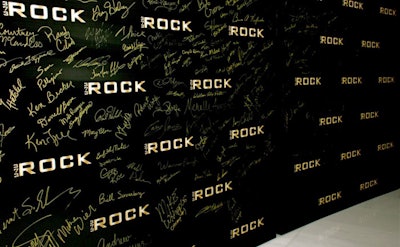 Attendees signed their name to the step-and-repeat upon registration at the beginning of the trip, with the name of Saturday's event later revealed as they posed for pictures in front of it upon arrival at LIV.