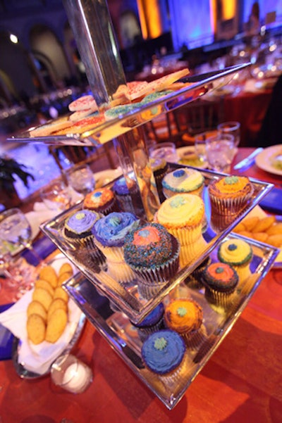 On each dinner table, a cupcake tower took the place of a floral arrangement.