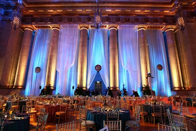 In the main space, large replicas of Greek coins hung between the venue's massive columns.