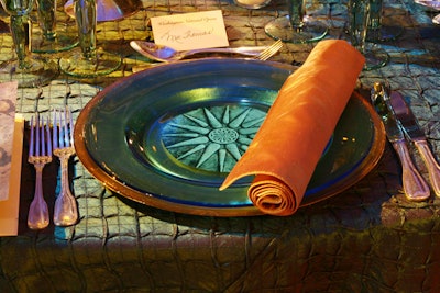 Tables alternated between salmon and blue silk linens.