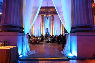 Drapes of sheer fabric softened the columned space.