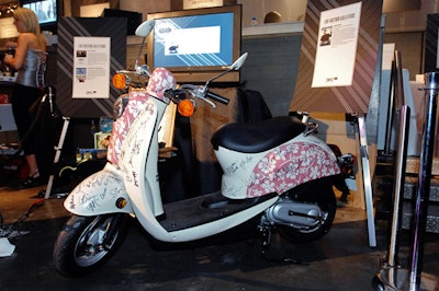 Auction items included a Honda Jazz scooter with more than 80 autographs from stars including Pierce Brosnan and Liam Neeson.