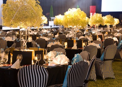Black and white striped chair covers from Chair Decor added to the simple colour scheme in the dining room.