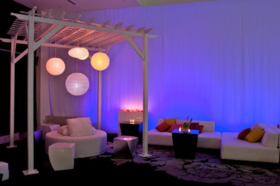 Large pergolas adorned with paper lanterns and white furnishings filled V.I.P. areas.