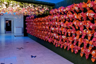 Gerbera daisies wrapped in tissue paper and faux grass lined the entrance corridor.