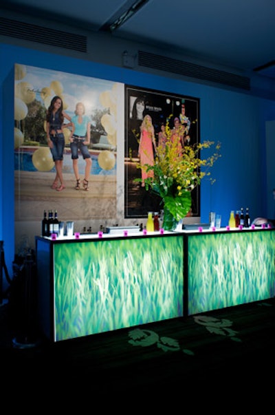 Wheatgrass appeared in floral arrangements and as backlit imagery in the freestanding bars.