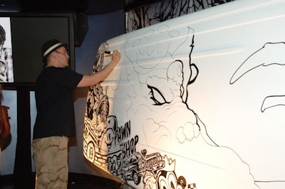 A graffiti artist tagged a Ford Flex roof inside Esquire's party.
