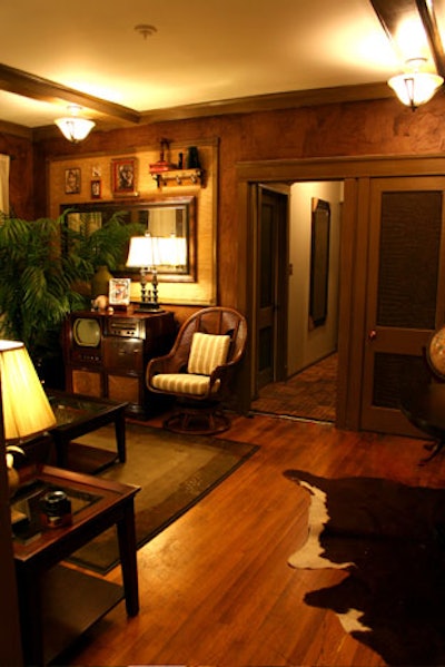 Men's Grooming Parlor features homey accents such as a retro television set and a cowhide rug.