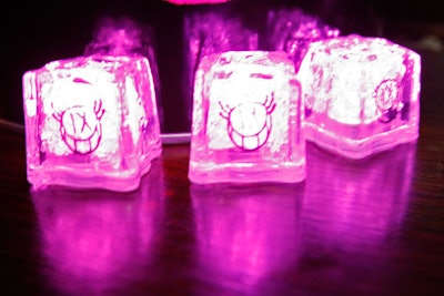 Lit-from-within plastic ice cubes bore French graffiti artist André's 'Mr. IX' logo created specifically for the brand.