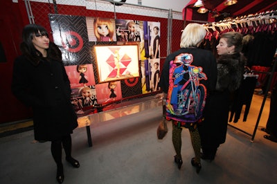 Posters from the McQ Alexander McQueen for Target ad campaign surrounded commissioned artwork from Brooklyn-based artist K8 Hardy.