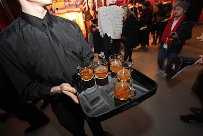 Great Performances served a variety of food and drinks, including a hot cider beverage accompanied by a stick of cinnamon.