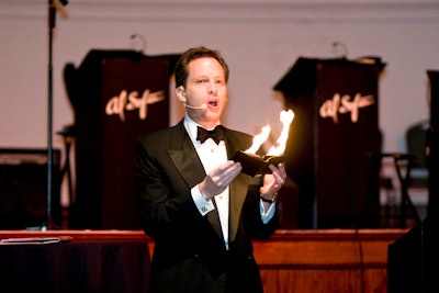 Before dinner, auctioneer David Goodman led a live auction that included magic tricks and prizes such as a Disney family cruise.