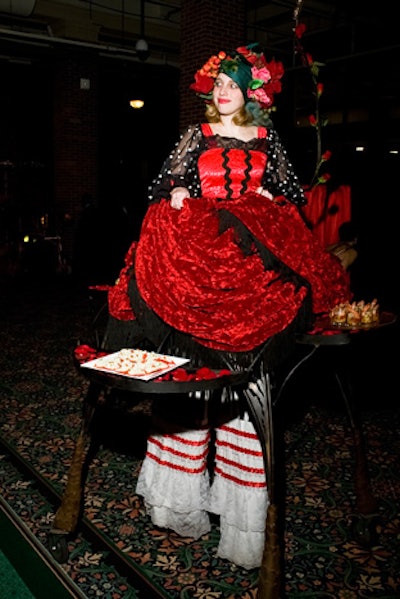 Another Redmoon performer, this one dubbed 'Table Lady,' strolled through the crowd with a tray of appetizers affixed to her costume.