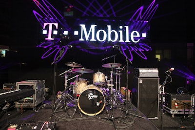 A glowing T-Mobile sign backed the stage.