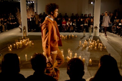 To evoke the inspiration for Trovata's fall line—late-'60s French culture—AL Productions lined the runway with hundreds of pillar candles.
