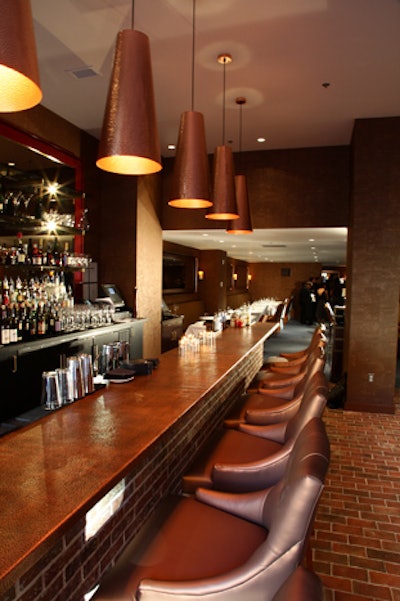 Beyond the eight-seat, copper-topped bar at the entrance, the main Brabo dining room seats 105.