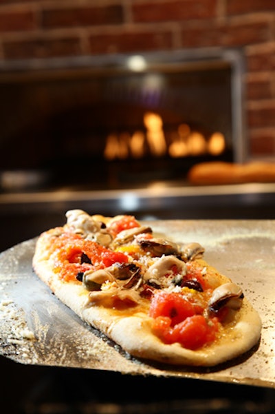 Wood-fired tarts are the signature dish at Brabo Tasting Room.