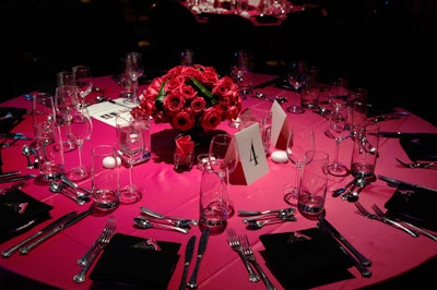 Pink linens and roses topped tables throughout the space.