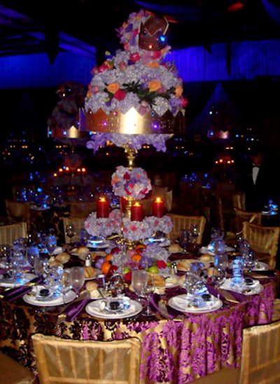 Exquisite Events created towering three-tier centerpieces with gold crown accents and a fruit base.