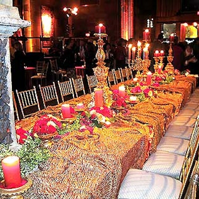 The main decor piece at the event was a long banquet table elaborately decorated with gold textured tablecloths from Cloth Connection and beautiful flowers set down the center of the tables. Ruth Fischl provided the gold table props.