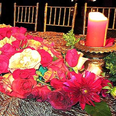The banquet table flowers included a beautiful abundance of roses and dahlias surrounded by greens.