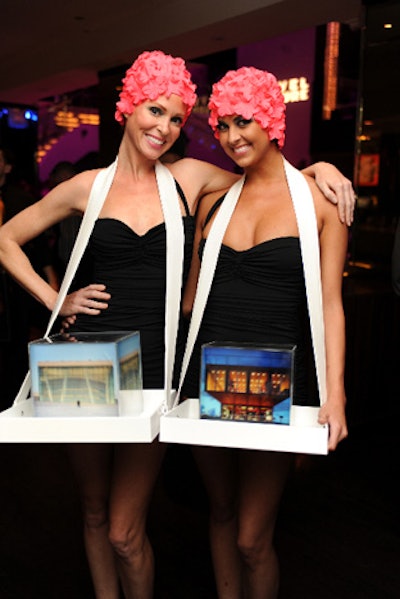 The Green Agency hired and styled the event's 16 models, each carrying a 10-inch photo cube, representing one of the evening's award winners, atop a plexiglass tray.