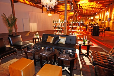 Event designers from XA, the Experiential Agency decked the raw space with chandeliers, lounge furniture, and gold-patterned lights.