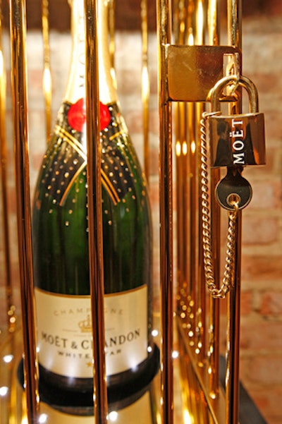 Bejeweled bottles of champagne filled tabletops and display cases throughout the venue.