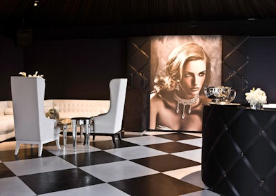 Oversized portraits contributed to a Hollywood Regency-style look in Piaget's lounge.