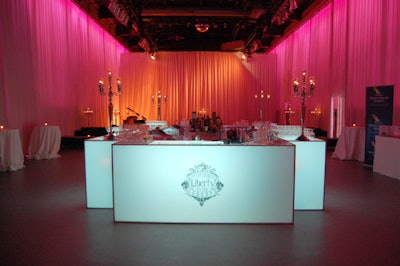 A lit-up bar bearing the Liberty Grand logo sat in the center of the space.