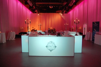 A lit-up bar bearing the Liberty Grand logo sat in the center of the space.